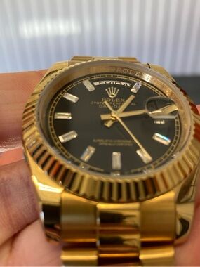 Rolex Gold Watch with Black Dial and Baguette Markers